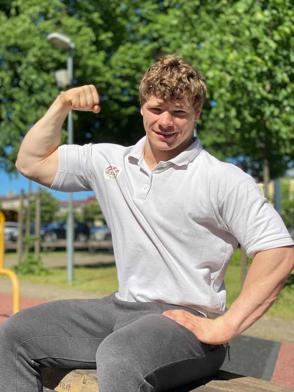 Coach Vadim outside in the park on a sunny day.